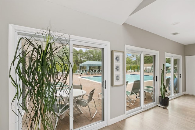 278 Pond View Ln, Smithtown, NY 11787 - entryway with wood finished floors and healthy amount of natural light