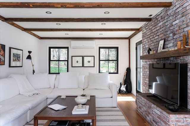 8 Maclean Dr, Pound Ridge, NY 10576 - living room with a wall mounted AC, healthy amount of natural light, beamed ceiling, and wood finished floors