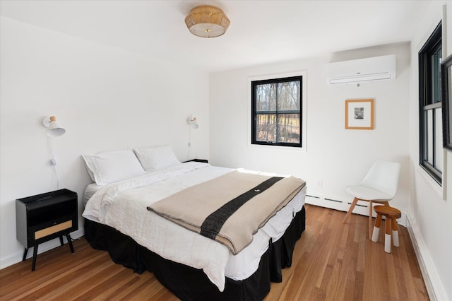 8 Maclean Dr, Pound Ridge, NY 10576 - bedroom with a wall mounted AC, wood finished floors, and a baseboard radiator