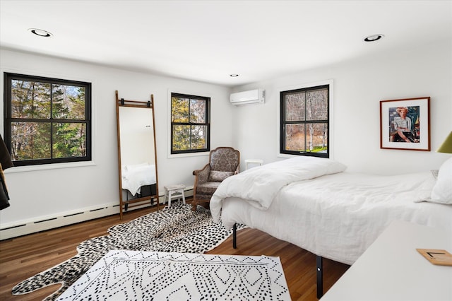 8 Maclean Dr, Pound Ridge, NY 10576 - bedroom featuring an AC wall unit, wood finished floors, a baseboard radiator, recessed lighting, and a barn door