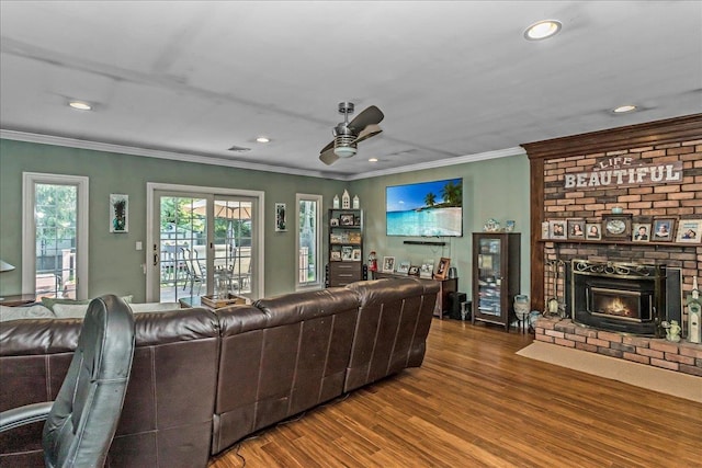 7 Woodstock Pl, Lake Grove, NY 11755 - living area featuring a fireplace, ceiling fan, wood finished floors, recessed lighting, and ornamental molding