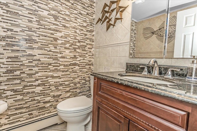 7 Woodstock Pl, Lake Grove, NY 11755 - bathroom featuring tile walls, baseboard heating, vanity, and backsplash