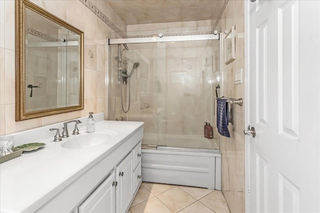 7 Woodstock Pl, Lake Grove, NY 11755 - bathroom featuring vanity, combined bath / shower with glass door, tile walls, and tile patterned floors