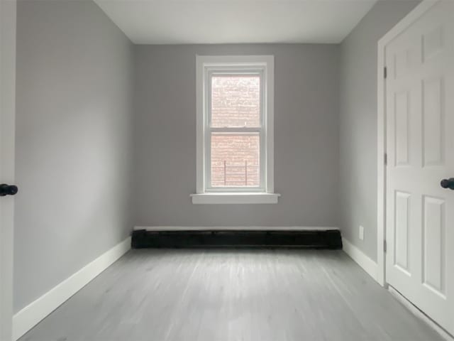 12 Liberty St, Newburgh, NY 12550 - empty room with baseboards and wood finished floors