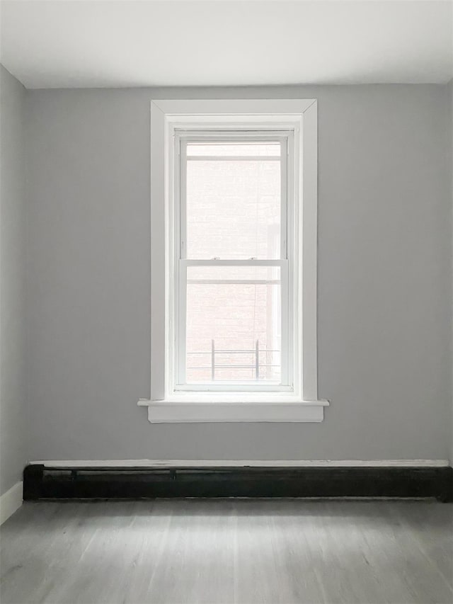 12 Liberty St, Newburgh, NY 12550 - empty room featuring baseboards and wood finished floors