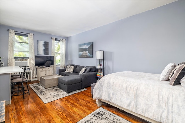 12 Hempstead Ave Unit 1G, Rockville Centre, NY 11570 - bedroom featuring dark wood-type flooring and cooling unit