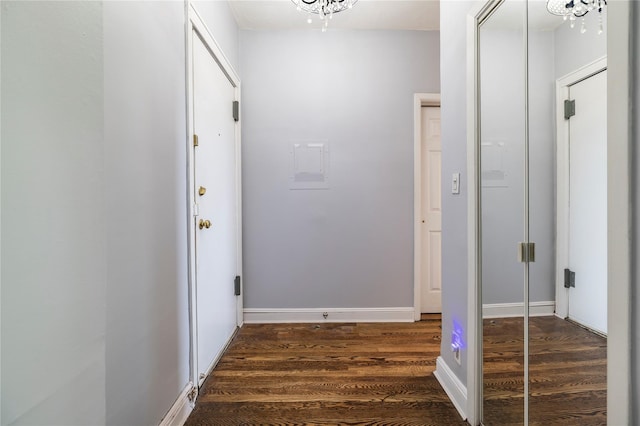 12 Hempstead Ave Unit 1G, Rockville Centre, NY 11570 - corridor featuring dark wood finished floors and a chandelier