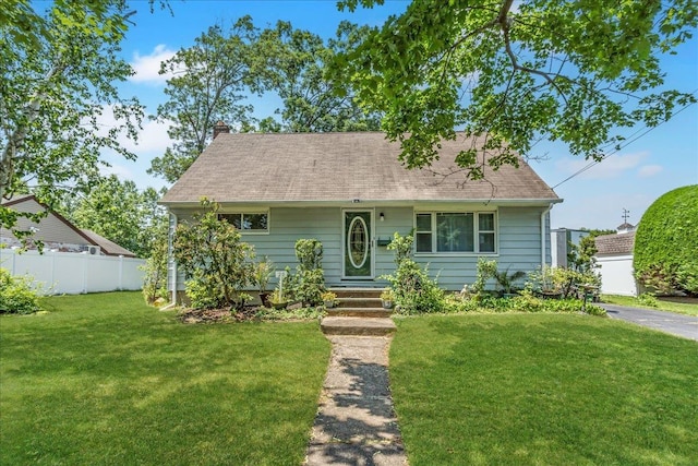 20 Hemlock Dr, Farmingdale, NY 11735 - cape cod-style house featuring a chimney and roof with shingles