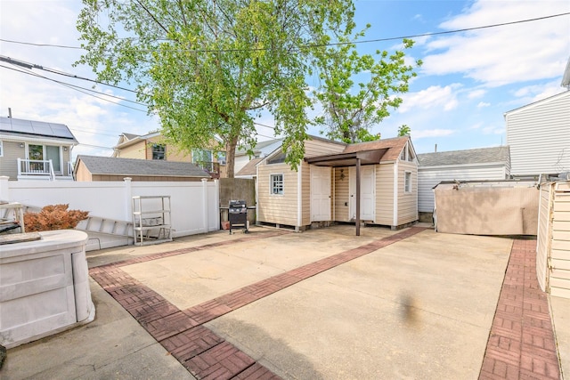 556 Long Beach Rd, Island Park, NY 11558 - view of patio / terrace featuring a grill and a storage unit
