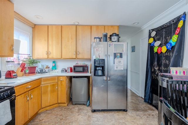 556 Long Beach Rd, Island Park, NY 11558 - kitchen with stainless steel fridge with ice dispenser, black gas stove, light countertops, and crown molding
