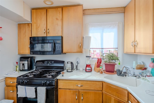 556 Long Beach Rd, Island Park, NY 11558 - kitchen with black appliances and light countertops