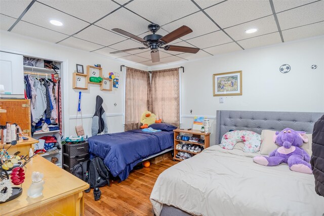 556 Long Beach Rd, Island Park, NY 11558 - bedroom with wood finished floors, a paneled ceiling, a closet, recessed lighting, and ceiling fan