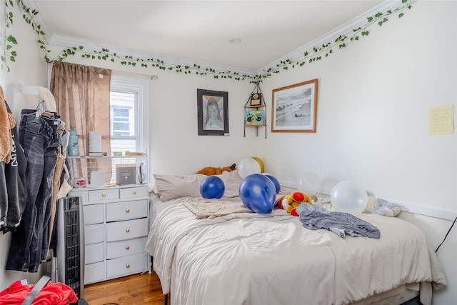556 Long Beach Rd, Island Park, NY 11558 - bedroom with crown molding and wood finished floors