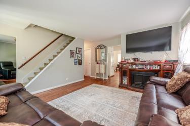 20 Wainwright St, Ronkonkoma, NY 11779 - living room with stairway and wood finished floors