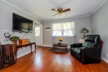 20 Wainwright St, Ronkonkoma, NY 11779 - sitting room featuring ceiling fan, wood finished floors, ornamental molding, and baseboard heating