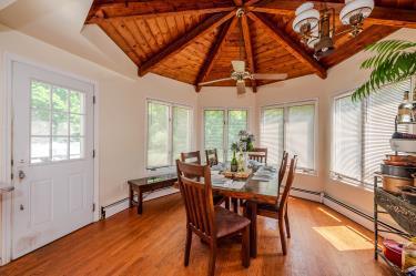 20 Wainwright St, Ronkonkoma, NY 11779 - dining room with wood ceiling, wood finished floors, a baseboard radiator, and a ceiling fan