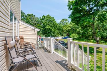 20 Wainwright St, Ronkonkoma, NY 11779 - wooden deck featuring view of scattered trees