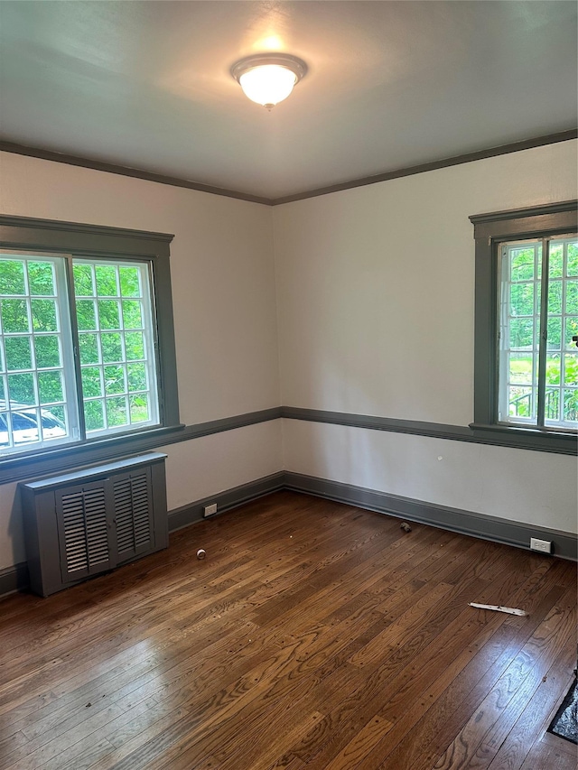 40 Broadway Unit 27, Irvington, NY 10533 - empty room featuring radiator heating unit, wood-type flooring, and crown molding