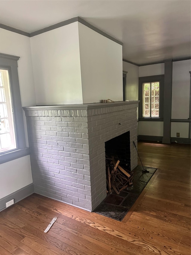 40 Broadway Unit 27, Irvington, NY 10533 - detailed view of wood finished floors, a fireplace, and crown molding