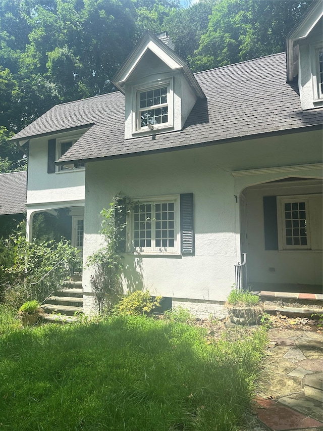 40 Broadway Unit 27, Irvington, NY 10533 - view of property exterior with stucco siding and a shingled roof