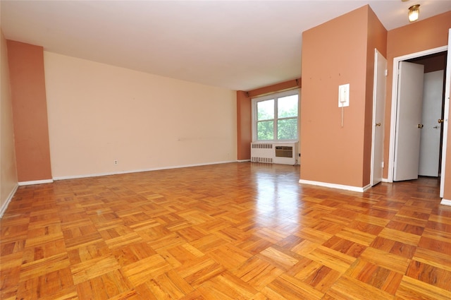 281 Garth Rd Unit B5D, Scarsdale, NY 10583 - spare room with radiator and baseboards
