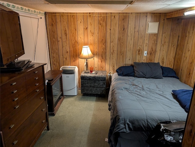 524 Polaris St, North Babylon, NY 11703 - bedroom featuring light carpet and wooden walls