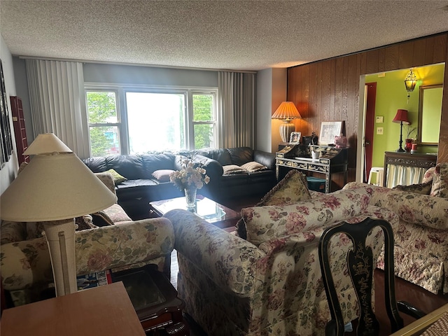 34 Harmony Rd, Spring Valley, NY 10977 - living room featuring a textured ceiling and wood walls