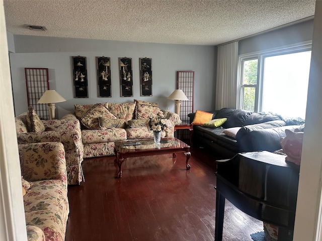34 Harmony Rd, Spring Valley, NY 10977 - living room featuring a textured ceiling and wood finished floors