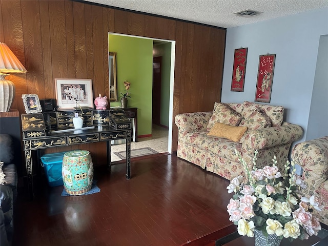 34 Harmony Rd, Spring Valley, NY 10977 - living area featuring wood finished floors, a textured ceiling, and wooden walls