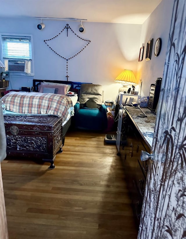 34 Harmony Rd, Spring Valley, NY 10977 - bedroom with wood finished floors, track lighting, and cooling unit