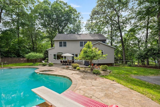 17 Dunmore Rd, New City, NY 10956 - view of swimming pool with a patio area, a fenced backyard, a diving board, and view of wooded area