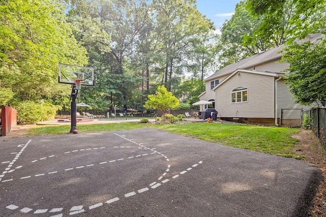 17 Dunmore Rd, New City, NY 10956 - view of basketball court featuring basketball hoop and view of wooded area