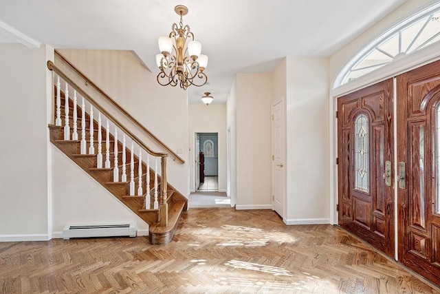 17 Dunmore Rd, New City, NY 10956 - foyer with a baseboard radiator, a chandelier, and stairs