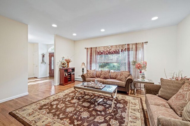 17 Dunmore Rd, New City, NY 10956 - living area with baseboard heating, recessed lighting, and wood finished floors