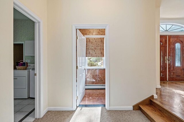 17 Dunmore Rd, New City, NY 10956 - entrance foyer with baseboard heating and washer and clothes dryer