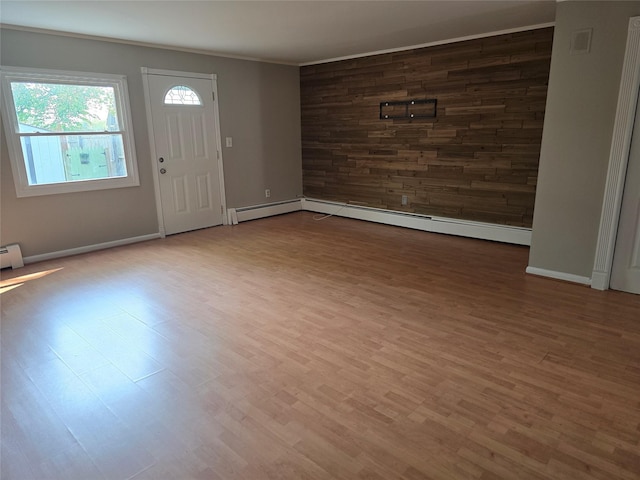 36 Hampton Ct, Middletown, NY 10941 - entrance foyer with wood finished floors, crown molding, and a baseboard radiator