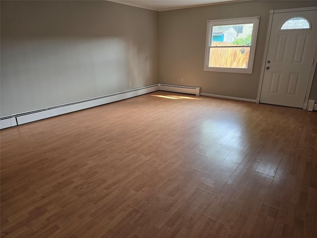 36 Hampton Ct, Middletown, NY 10941 - empty room with wood finished floors and a baseboard radiator