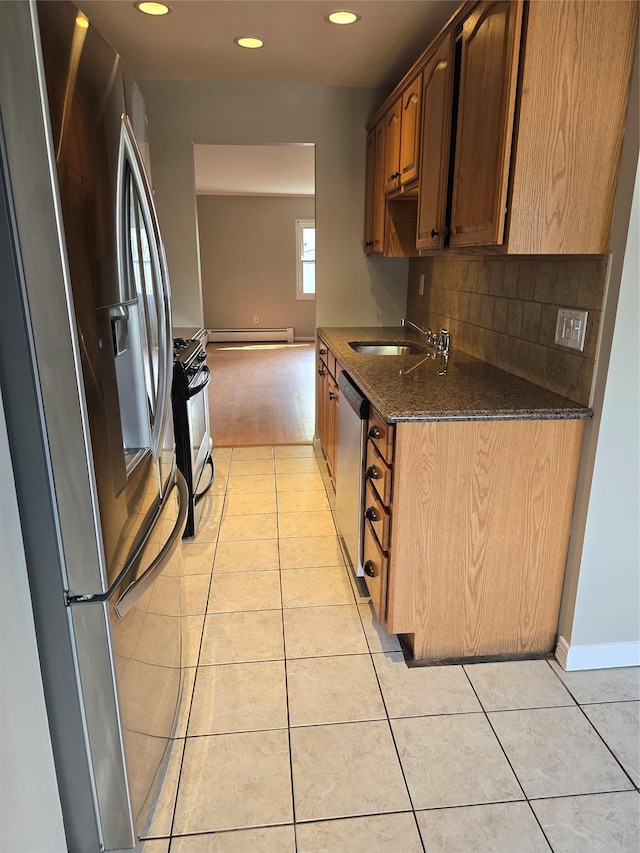 36 Hampton Ct, Middletown, NY 10941 - kitchen with stainless steel appliances, light tile patterned floors, dark stone countertops, decorative backsplash, and recessed lighting