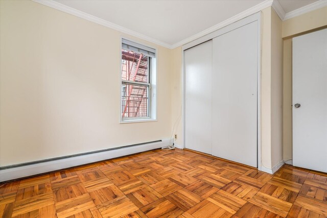 151-05 Cross Island Pkwy Unit 1D, Whitestone, NY 11357 - unfurnished bedroom with baseboard heating, crown molding, and a closet