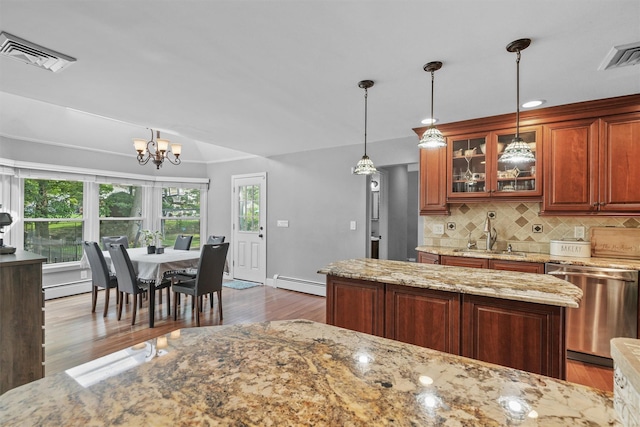 25 Bellwood Dr, New City, NY 10956 - kitchen with dishwasher, a baseboard heating unit, backsplash, wood finished floors, and glass insert cabinets