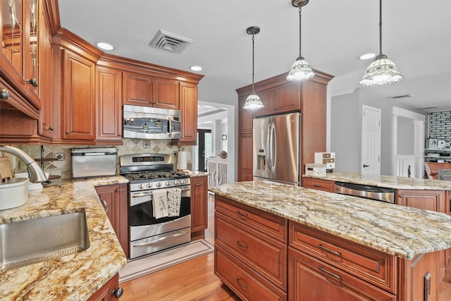 25 Bellwood Dr, New City, NY 10956 - kitchen featuring appliances with stainless steel finishes, backsplash, light stone countertops, and recessed lighting