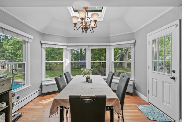 25 Bellwood Dr, New City, NY 10956 - dining area featuring a chandelier, baseboard heating, healthy amount of natural light, light wood finished floors, and ornamental molding