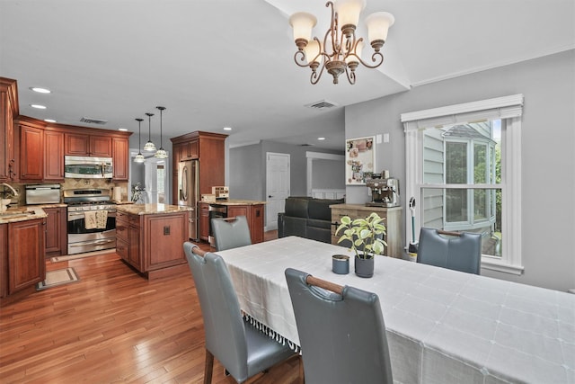 25 Bellwood Dr, New City, NY 10956 - dining room with light wood finished floors, a chandelier, and recessed lighting