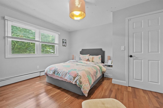 25 Bellwood Dr, New City, NY 10956 - bedroom featuring light wood-style flooring and a baseboard radiator