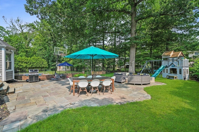 25 Bellwood Dr, New City, NY 10956 - view of patio featuring a playground, an outdoor hangout area, and view of wooded area