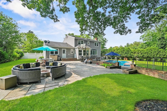 25 Bellwood Dr, New City, NY 10956 - rear view of property with a patio, a chimney, a fenced backyard, and an outdoor living space with a fire pit