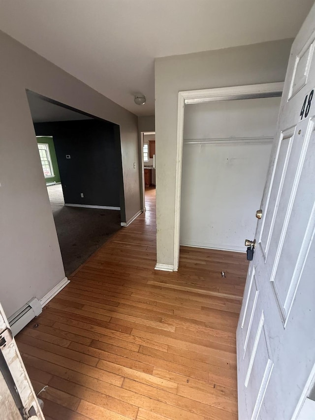 48 Patmore Ave, Yonkers, NY 10710 - corridor featuring baseboard heating and light wood-type flooring