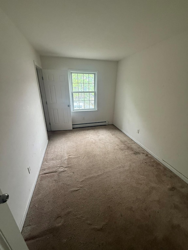 48 Patmore Ave, Yonkers, NY 10710 - unfurnished room with baseboard heating and light carpet