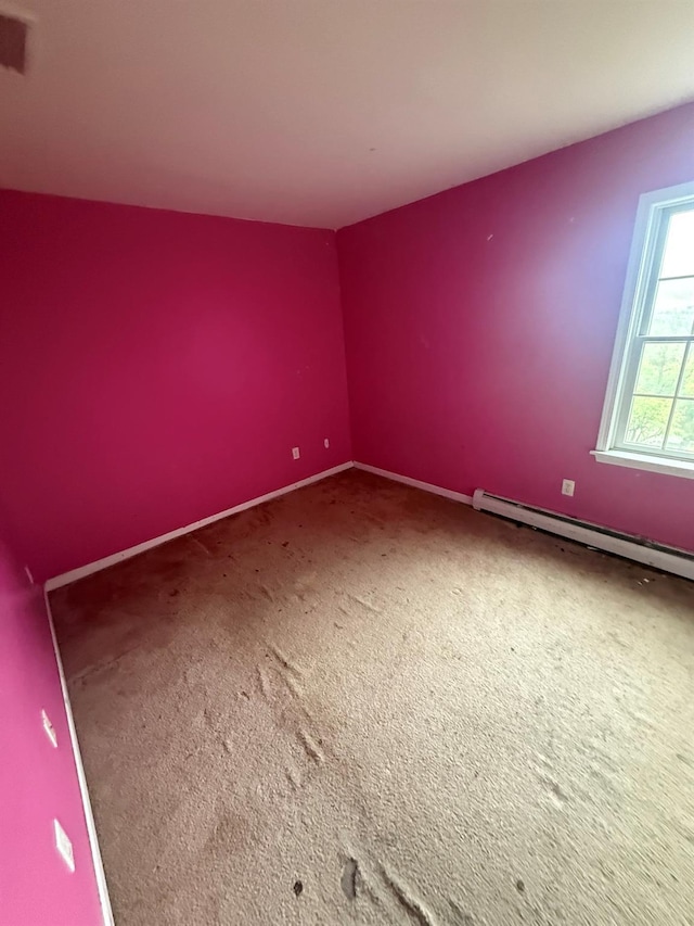 48 Patmore Ave, Yonkers, NY 10710 - carpeted empty room with a baseboard heating unit and baseboards