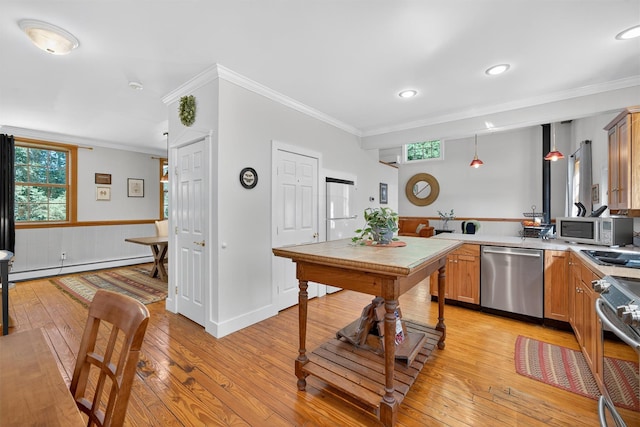 62 Guymard Tpke, Godeffroy, NY 12729 - kitchen with appliances with stainless steel finishes, a baseboard heating unit, a peninsula, crown molding, and light wood-style flooring